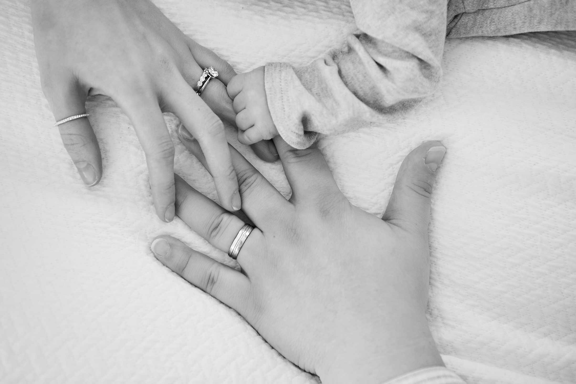 black-and-white-parents-and-baby-hands-rings-portland-family-photographer